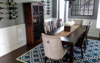 dining room with wood table and blue rug